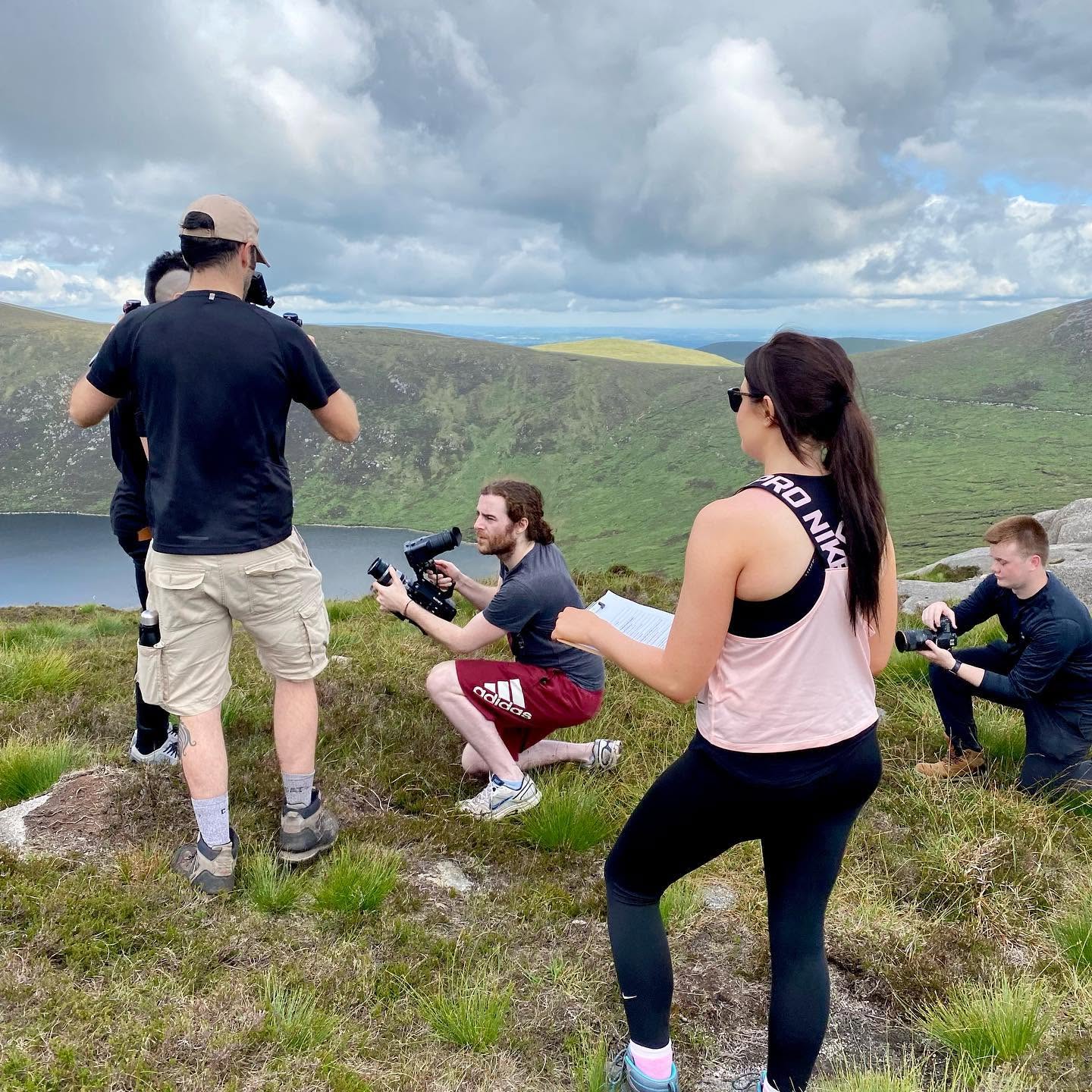 A film crew works with contributors on a hillside in the Mourne Mountains.